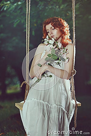 Romantic portrait of a beautiful woman with red hair Stock Photo