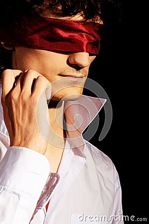 Romantic portrait of a handsome blindfold man Stock Photo