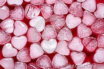 Romantic red background of hearts. Card with heart shaped ice. Texture, pattern. Symbol of valentine`s day Stock Photo