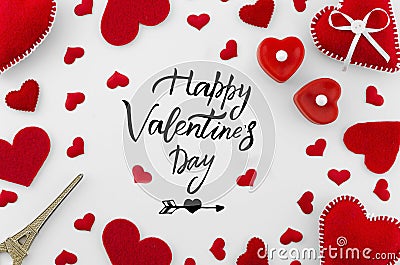 Romantic red flat lay composition on white background. Heart top view. Happy Valentines day hand lettering greeting card Stock Photo