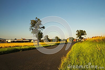 Romantic road between fields leading to village Keblice in Ceske stredohori region in Czech republic Stock Photo