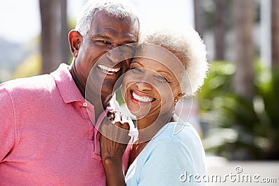 Romantic Senior Couple Hugging In Street Stock Photo