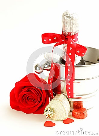 Romantic still life champagne, roses, gifts Stock Photo