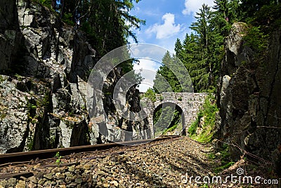 Romantic stone bridge over railway in beautiful forest, Czech republic Stock Photo
