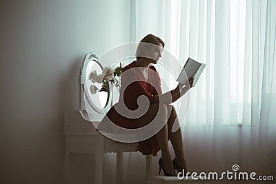 Romantic story. elegant woman read romantic story. book with romantic story. romantic story reading. imagination Stock Photo