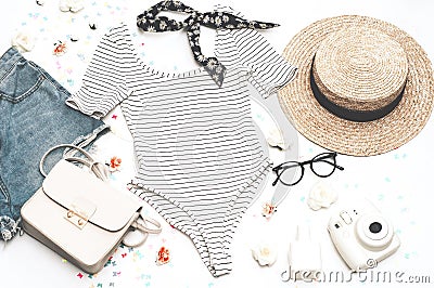 Romantic summer look. Female body shirt, straw hat, glasses and a small handbag Stock Photo