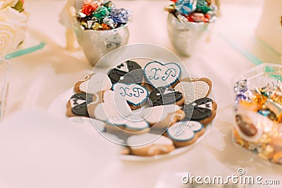 Romantic tasty heart shaped cookies with initials closeup Stock Photo