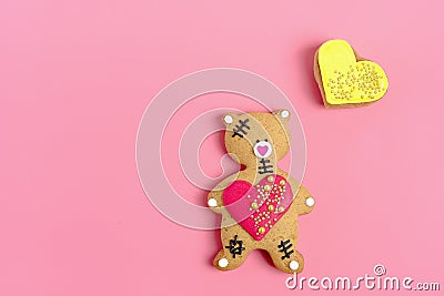 Romantic Teddy bear, gingerbread heart on trendy pink background. Stock Photo
