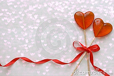 Romantic Valentine`s day background. Lollipops in the shape of heart close up on white background. Stock Photo