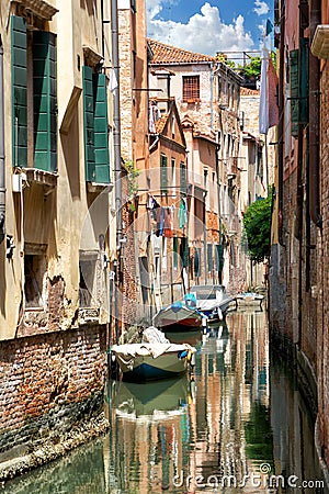 Romantic view of an old narrow water street in Venice Stock Photo