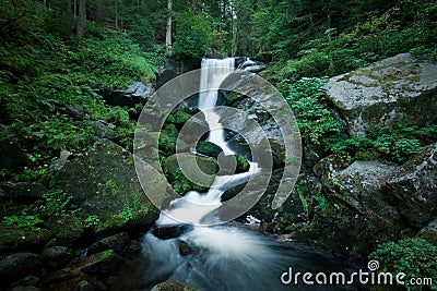 Romantic Waterfall inside the forrest Stock Photo