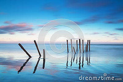 Romantic wharf in Auckland of New Zealand Beautiful pier on sunrise with pink cloud sky .Summer Landscape Stock Photo