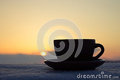 Romantic cup of coffee or tea in rays of sunset Stock Photo