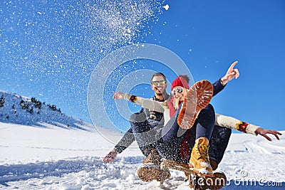 Romantic winter scene, happy young couple having fun on fresh show on winter vacatio, mountain nature landscape Stock Photo