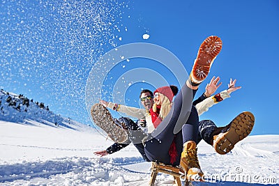 Romantic winter scene, happy young couple having fun on fresh show on winter vacatio, mountain nature landscape Stock Photo