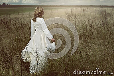 Romantic woman in the fields Stock Photo