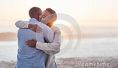 Content young African couple embracing each other at the beach Stock Photo