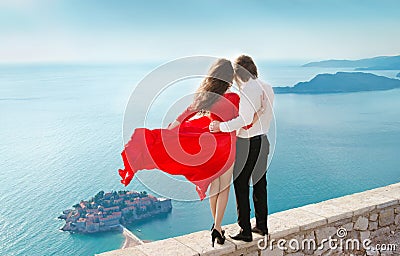 Romantic young couple in love over sea shore background. Fashion Stock Photo