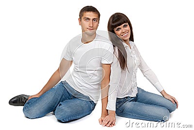 Romantic young couple sitting on floor Stock Photo