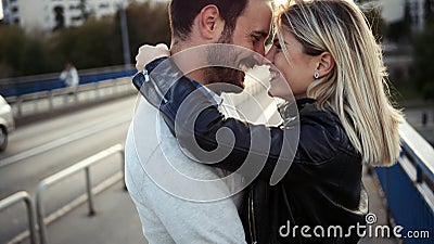 Romantic young happy couple kissing and hugging Stock Photo