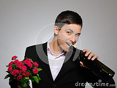 Romantic young man with flowers on a date Stock Photo