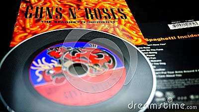 CDs and artwork of the American hard rock band GUNS AND ROSES Editorial Stock Photo