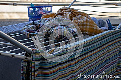 Quarantine has forced us to do simple things. Hang the laundry in the sun to dry it. Stock Photo