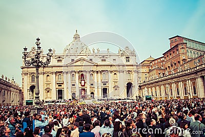 Rome, Italy - April 24, 2011: Crowds gather outside St. Peter`s Basillica in Rome on Easter Sunday. Editorial Stock Photo