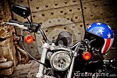 ROME, ITALY - APRIL, 25: Motorcycle Harley Davidson with helmet with American flag style, April 25, 2013 Editorial Stock Photo