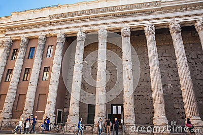 Tourists and locals at the surviving side colonnade of the Temple of Hadrian Editorial Stock Photo