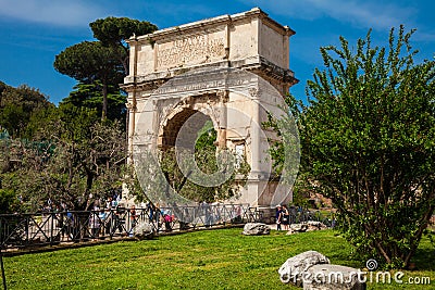 Tourists visiting the Arch of Titus located on the Velian Hill Editorial Stock Photo