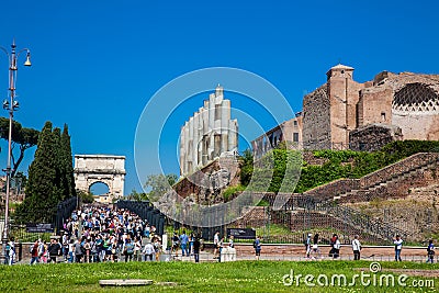 Tourists visiting the Ruins of the Temple of Venus and Roma located on the Velian Hill and Arch of Editorial Stock Photo