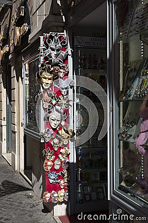 Sale of souvenir Venetian masks in a shop in the center of Rome Editorial Stock Photo