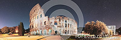 Rome, Italy. Colosseum Also Known As Flavian Amphitheatre In Evening Or Night Time. Bold Bright Blue Night Starry Sky Stock Photo