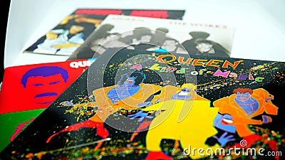 CD albums of the famous English group QUEEN. selective focus on album A KIND OF MAGIC Editorial Stock Photo