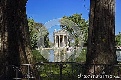 Rome Italy. Garden of Villa Borghese. Lake with boats and temple Stock Photo