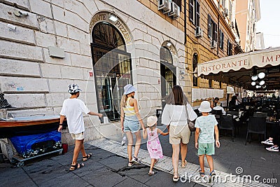 Rome, Italy - July 27, 2022: Family tourists walk in street, Rome, Italy Editorial Stock Photo