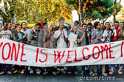 Rome, Italy - 20 june 2018: african migrants and refugees march asking for hospitality and residence permit Editorial Stock Photo