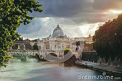 Tiber River and St. Peter`s Dome at sunset in the Vatican City in Rome in Italy. Cavour bridge and Castle of the Holy Angel Editorial Stock Photo