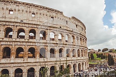 ancient Colosseum ruins with crowded square Editorial Stock Photo