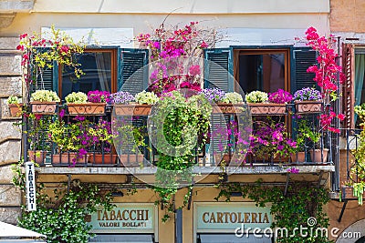 Rome, Italy. May 25, 2020: Balcony with flowers and plants in the historic center of Rome in Italy. Spring flowers in Piazza Editorial Stock Photo