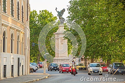 Rome, Italy - May 30, 2018: Evening streets of Rome, view on the roadway. Beautiful statue of an angel on a column at the entrance Editorial Stock Photo
