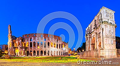 Rome, Italy: Night view of The Arch of Constantine next to the Colosseum after sunset over a blue sky Stock Photo