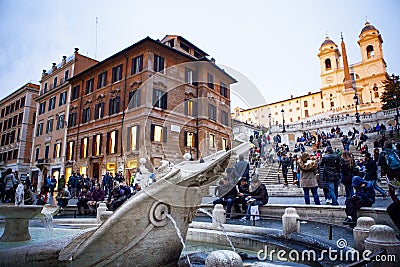 ROME ITALY - NOVEMBER 8 : large number of tourist sitting in front of spanish step fountain important traveling landmark and Editorial Stock Photo