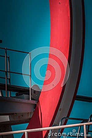 Abandoned metal diving structure. Iconic industrial and sports architecture, white and red steel elements on a deep blue clear sky Stock Photo