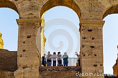 Silhouettes of group of people in Colosseum`s arch in Rome, Italy Editorial Stock Photo