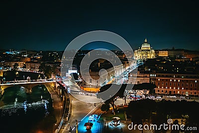 Rome, Italy, panorama of historical center at night. Vatican dome of Saint Peter Basilica, bridge over Tiber river and Stock Photo