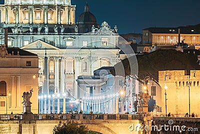 Rome, Italy. St. Peter`s Square With Papal Basilica Of St. Peter In The Vatican And Aelian Bridge In Evening Night Stock Photo