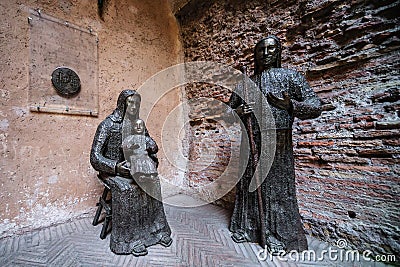 Modern sculpture in courtyard of old Basilica St Mary built at ancient Baths of Diocletian in Rome, Italy Editorial Stock Photo