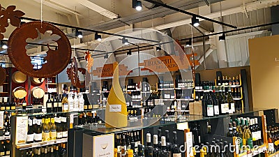 Wine department of various Italian regions and spirits in Rome`s Eataly Editorial Stock Photo